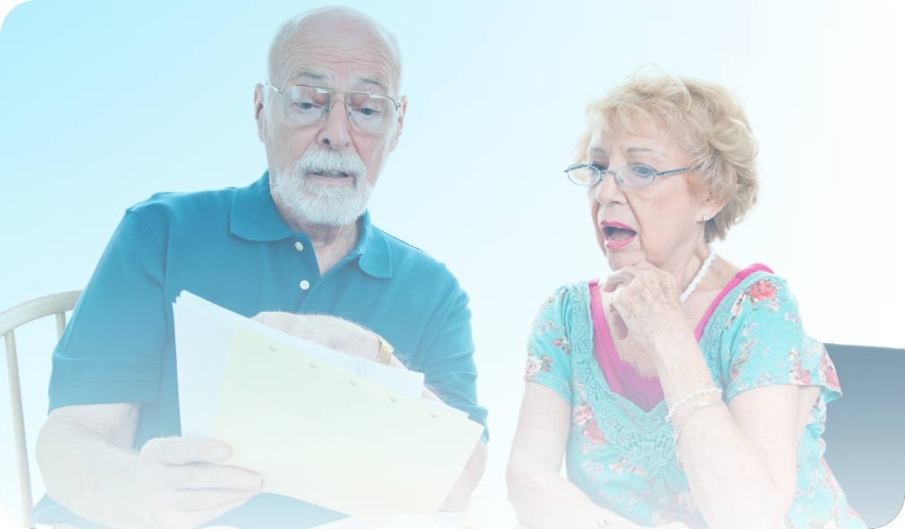 Senior couple reviewing Medicare part D paperwork