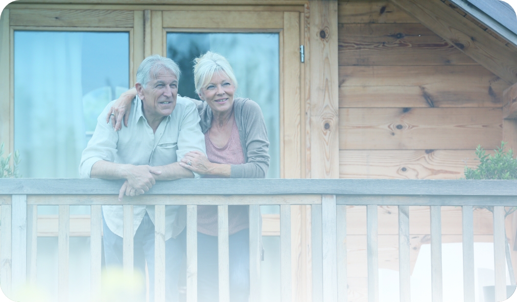 Senior couple at home, standing on their porch